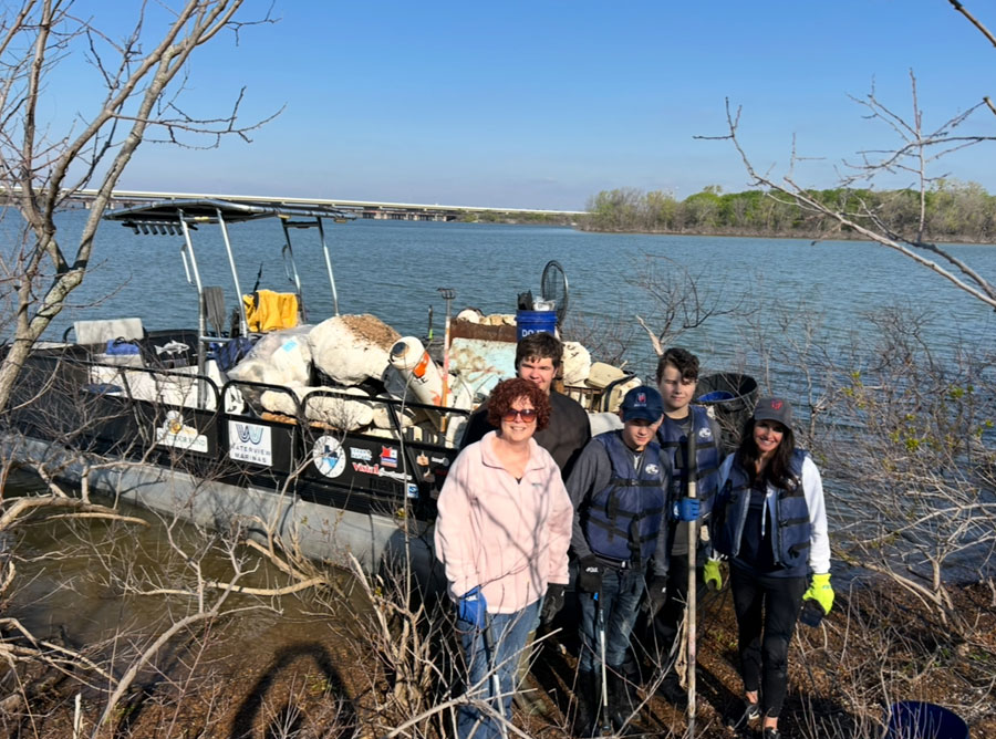 Image of a happy family outdoors, featuring Clear Texas Lakes and highlighting the services they offer under 'What We Do' to enhance lakeside living.